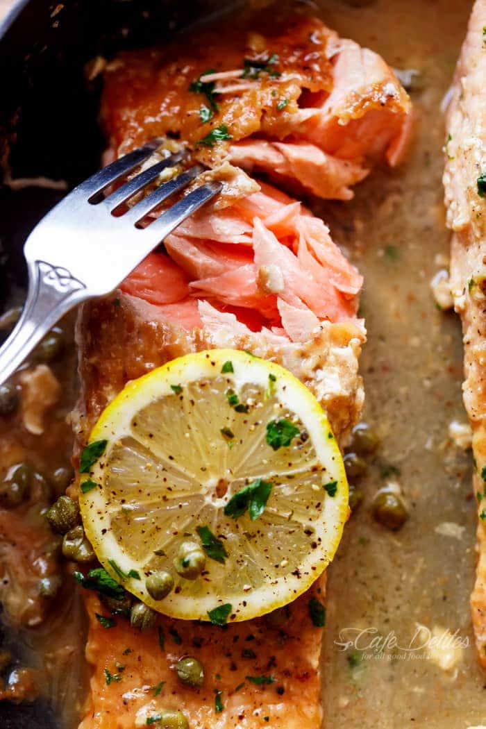 Image focusing on inner part of Easy Salmon Piccata with all of the authentic Piccata flavours of white wine, capers, lemon and garlic.