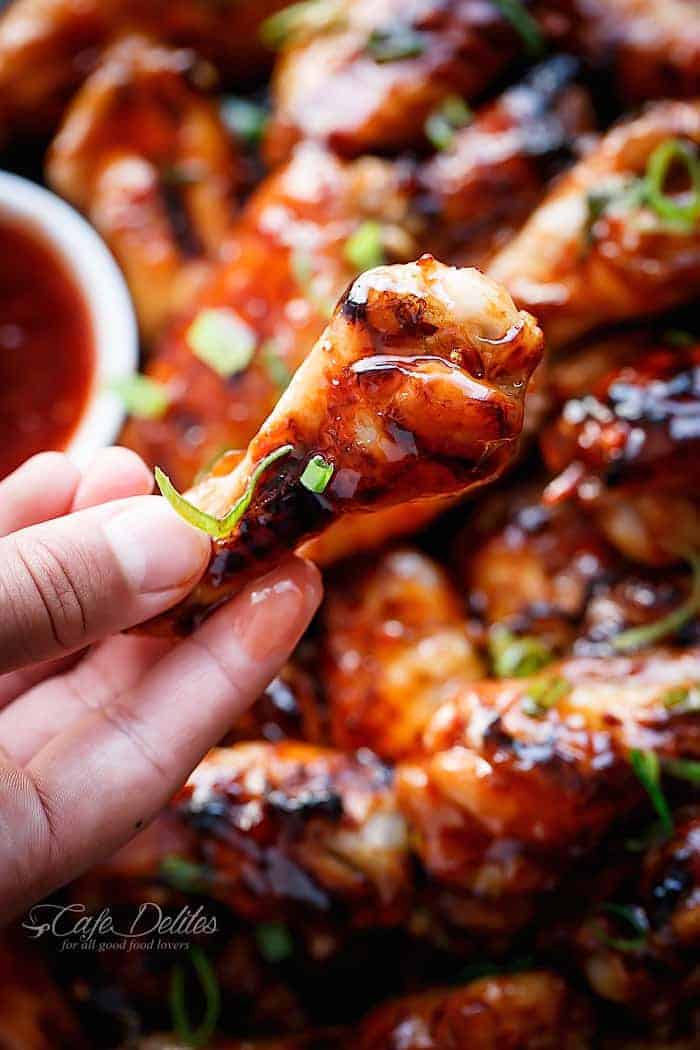 Sticky Thai Chicken Wings piece in hand