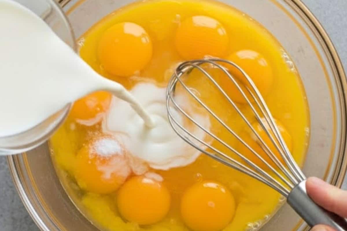 Whisk eggs, milk, and a pinch of salt in a medium bowl until smooth