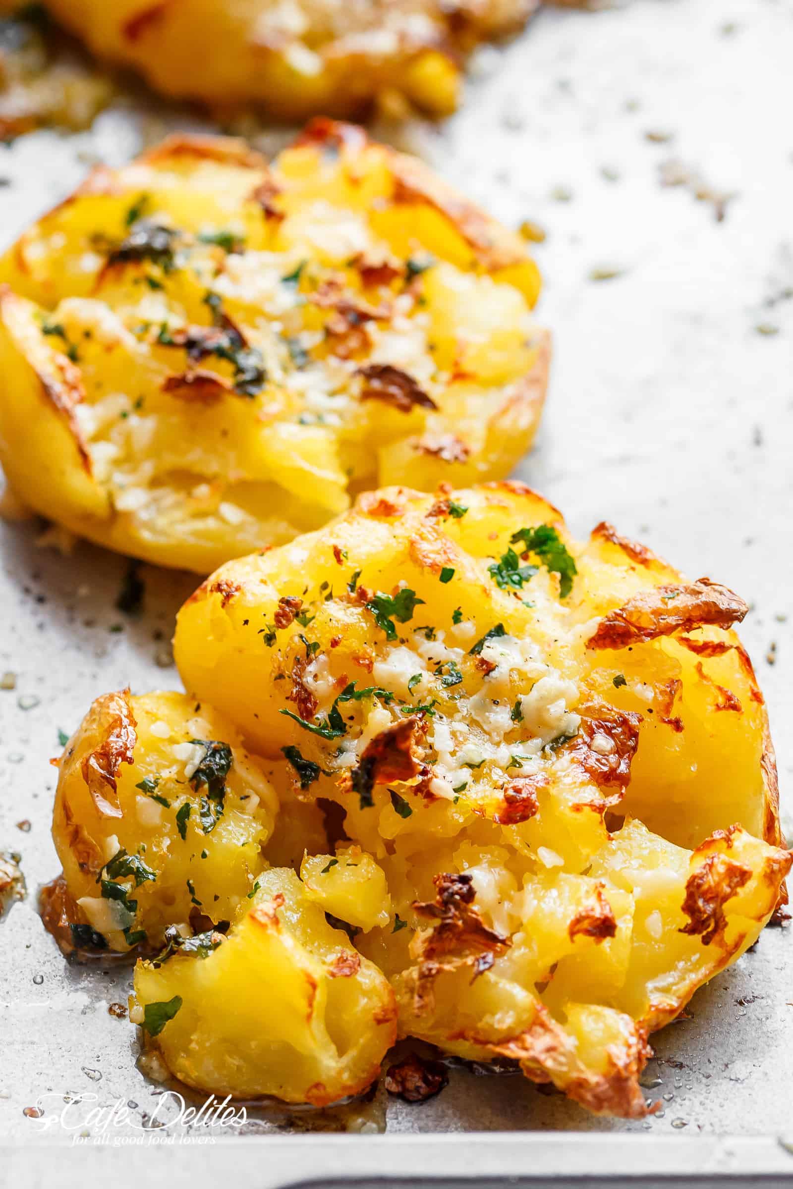 2 pieces of Crispy Garlic Butter Parmesan Smashed Potatoes