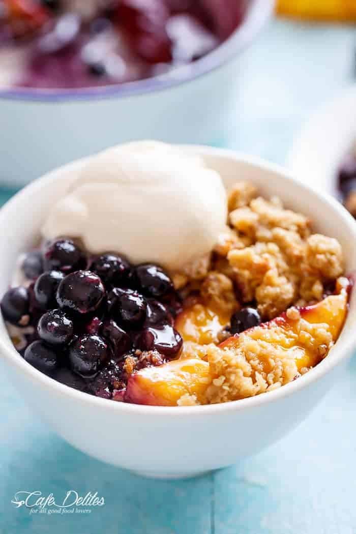 Easy Mango Blueberry Crumble with an ice cream scoop