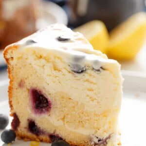 A piece of Blueberry Lemon Cheesecake Cake