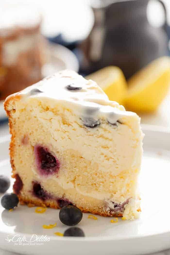 A piece of Blueberry Lemon Cheesecake with a Lemon Cream Cheese Glaze 
