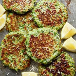 Crispy Broccoli Parmesan Fritters with lemon wedges