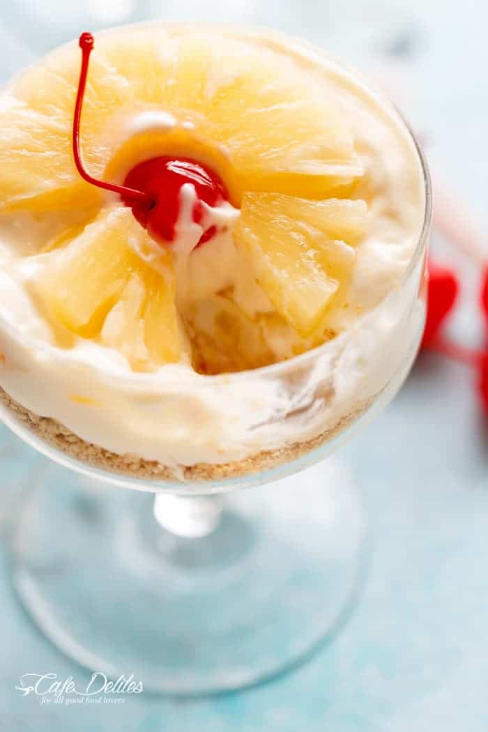 A piece taken from No Bake Pineapple Cheesecakes