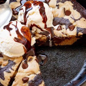 A piece removed from Chocolate Chip Cookie Marbled Skillet Brownie