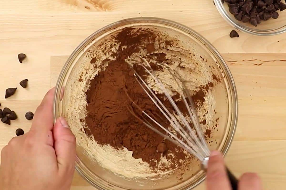 Whisked the melted butter with both sugars, then added in the cocoa powder in a medium bowl.