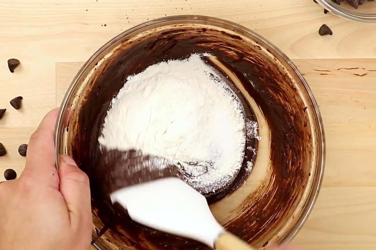 Folding in the flour and salt in the batter.