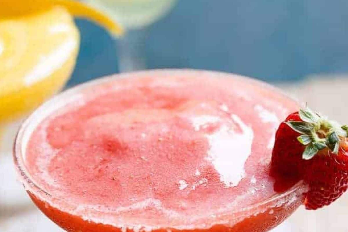 Add the tequila, Triple Sec or Cointreau, lime juice, ice, and frozen fruit to a blender.