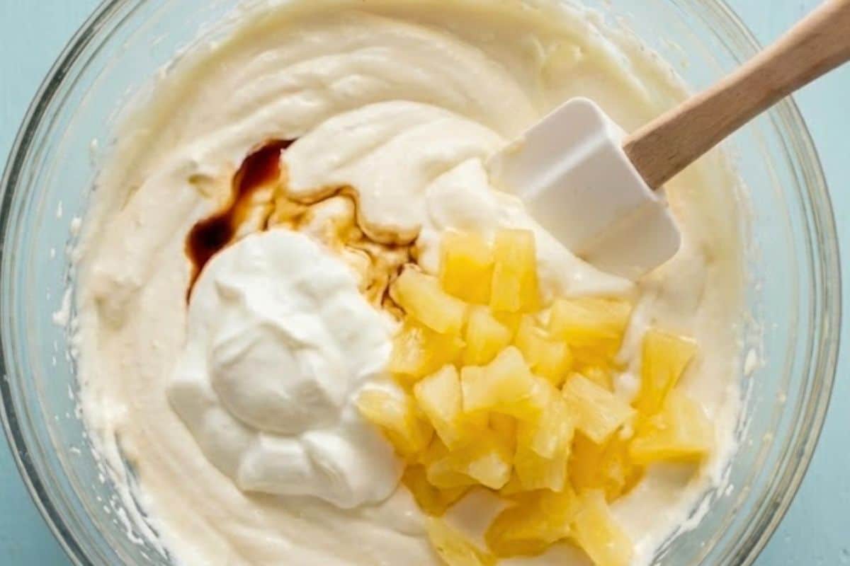 Gently fold in the Greek yogurt, pineapple, and vanilla until fully combined