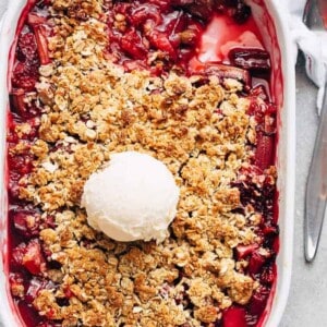 Strawberry Rhubarb Crisp with ice cream scoop