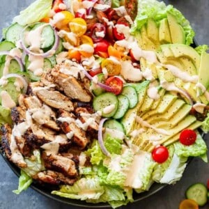 Grilled Cajun Chicken Salad with Creamy Cajun Dressing on a platter