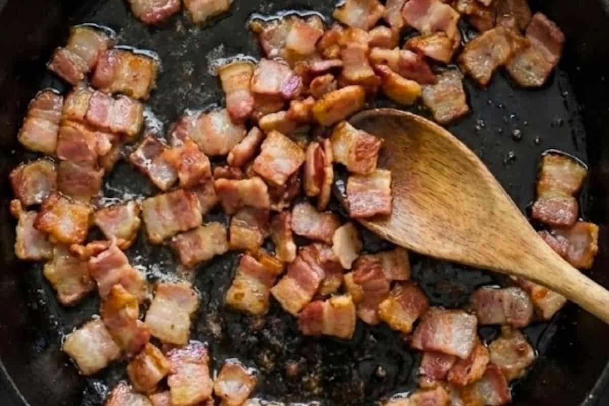 Heat a grill pan or skillet over medium heat with a small drizzle of olive oil. Cook the diced bacon until golden and crispy.