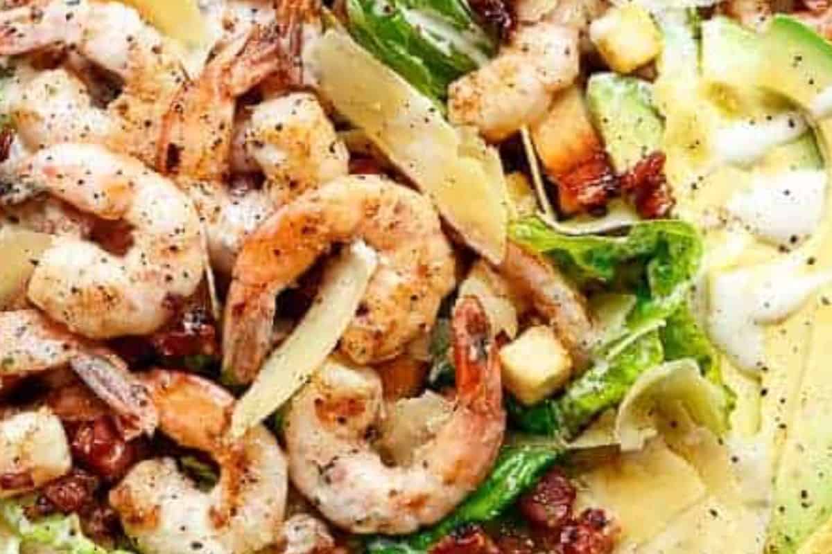 Pour the Caesar dressing over the salad and gently toss until everything is evenly coated