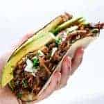 Slow Cooker Barbacoa Short Rib Tacos in hand