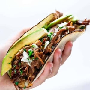 Slow Cooker Barbacoa Short Rib Tacos in hand