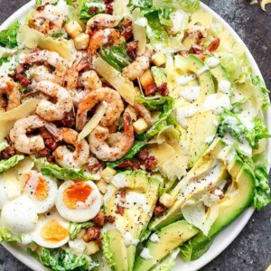 Grilled Lemon Garlic Shrimp Caesar Salad on a platter