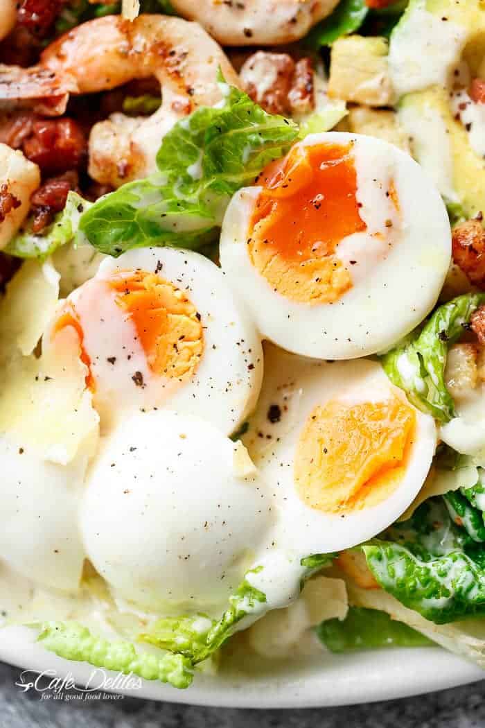 Image focusing on egg from Skinny Lemon Garlic Shrimp Caesar Salad
