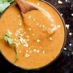 Satay Dipping Sauce with wooden spoon in a bowl