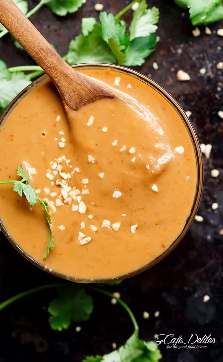 Satay Dipping Sauce with wooden spoon in a bowl