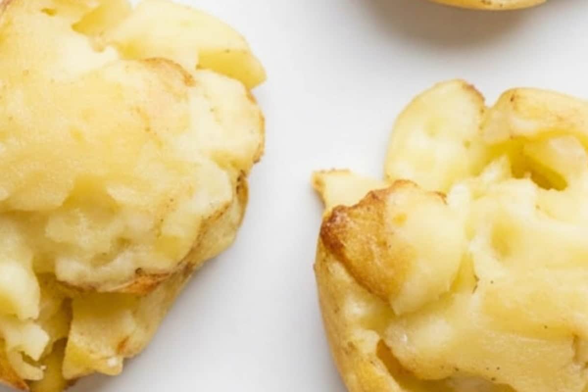 Gently flatten each potato with a masher until slightly smashed