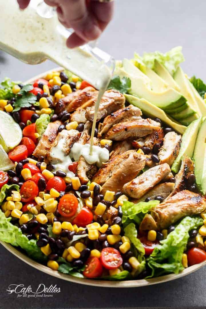 A Low Fat Creamy Dressing pouring over Southwestern Chicken Salad