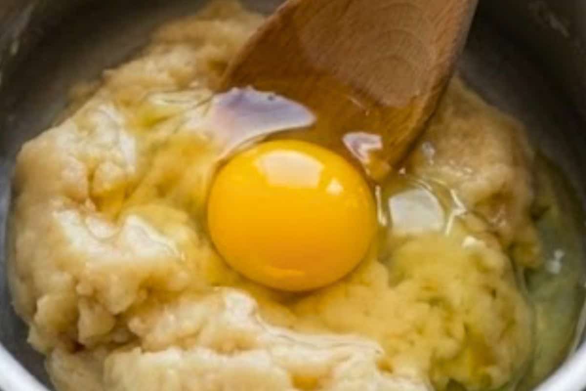Remove the dough from heat and let it cool for about 5 minutes until warm to the touch. Beat in one egg at a time