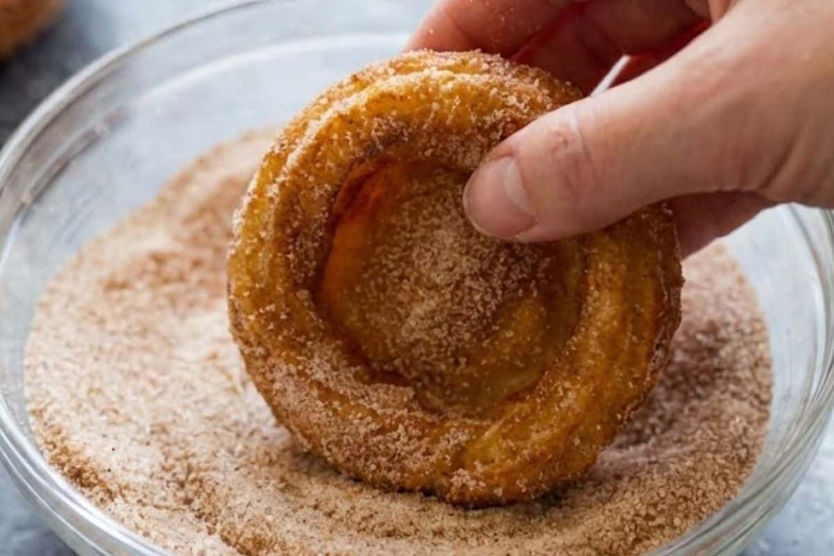 Fill a shallow bowl with cinnamon sugar and coat each churro bowl