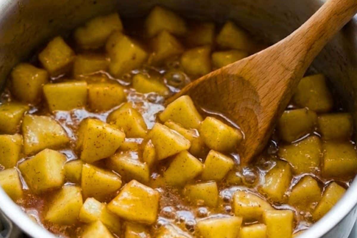Combine diced apples with lemon juice in a saucepan and set aside. In another pan, whisk cornstarch and water until smooth, then add brown sugar, cinnamon, and nutmeg; bring to a boil, add apples, cover, and simmer 8–10 minutes