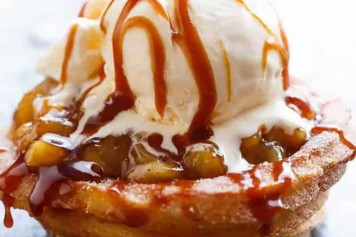 In a saucepan, combine brown sugar and heavy cream over medium-low heat, stirring until the sugar melts. Add butter and simmer for about 8 minutes until the sauce thickens slightly, then fill each churro bowl with apple filling, drizzle with caramel, and top with ice cream.