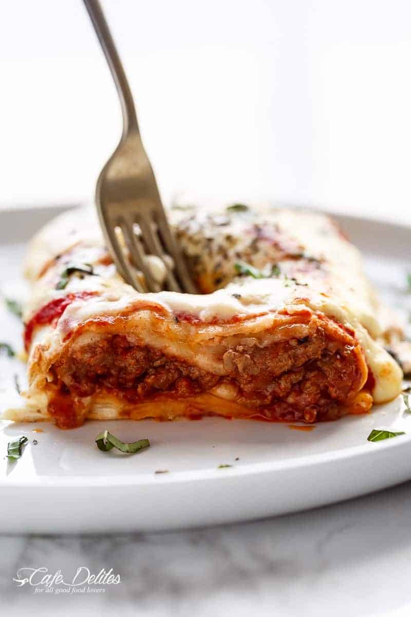 Fork poked into Lasagna Stuffed Burritos