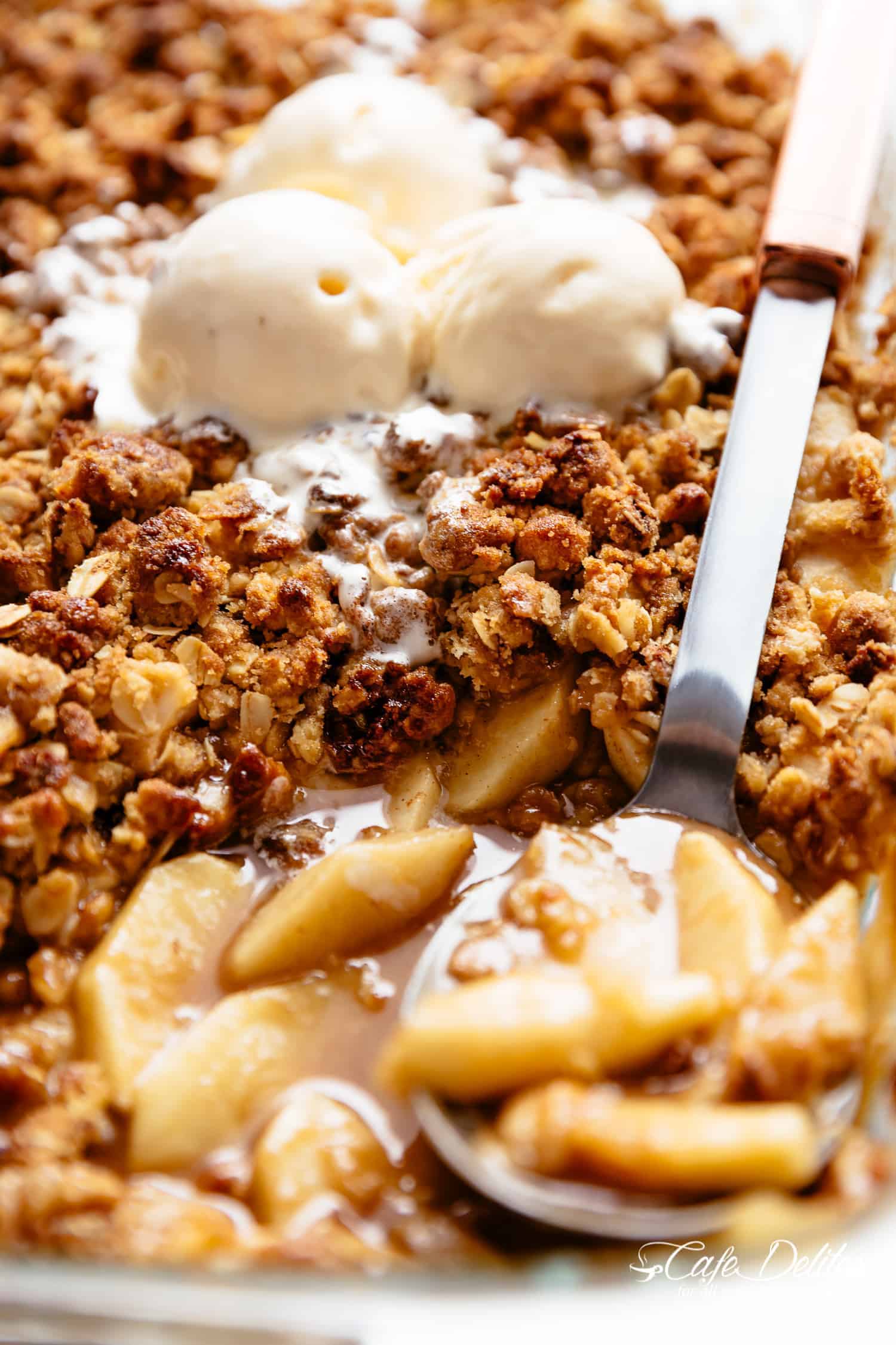 Apple Crumble: apple pie filling is covered with a crispy oatmeal cookie-like topping in a spoon