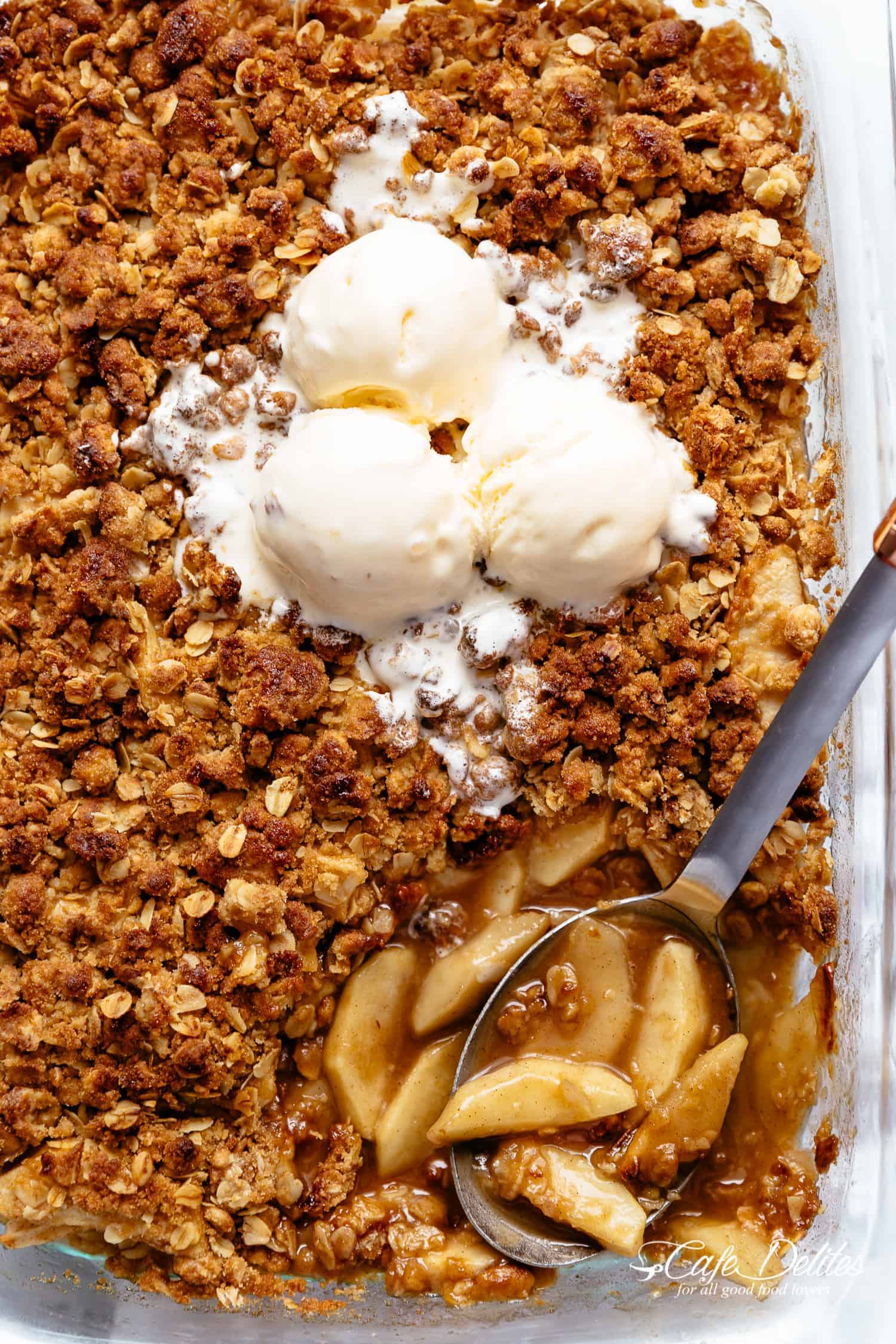 Easy Cinnamon Apple Crumble with ice-cream is foolproof! A juicy apple pie filling is covered with a crispy oatmeal cookie-like topping! BEST apple crumble!
