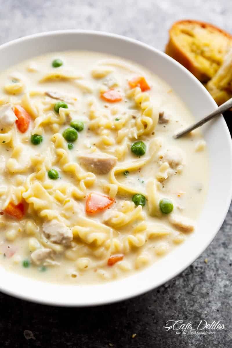 Creamy Chicken Noodle Soup with spoon in a bowl
