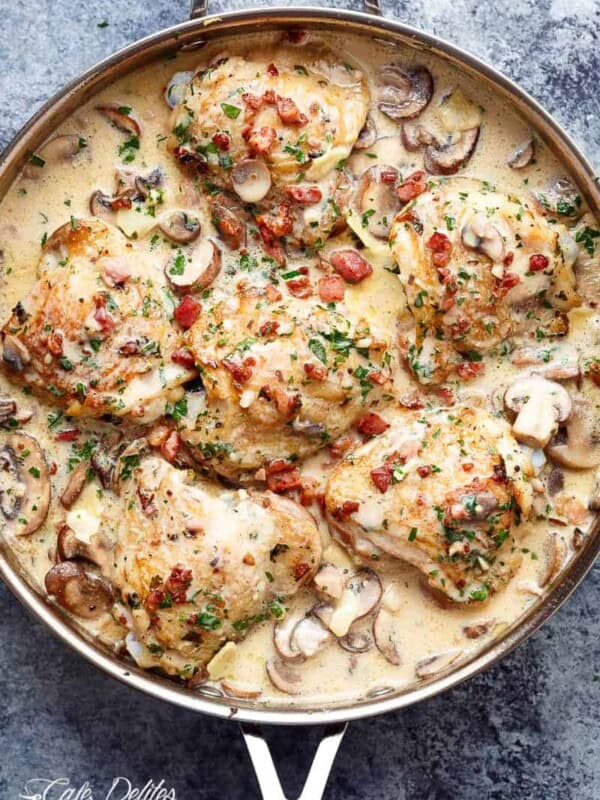Creamy Baked Chicken Thighs with Mushrooms & Bacon in a platter