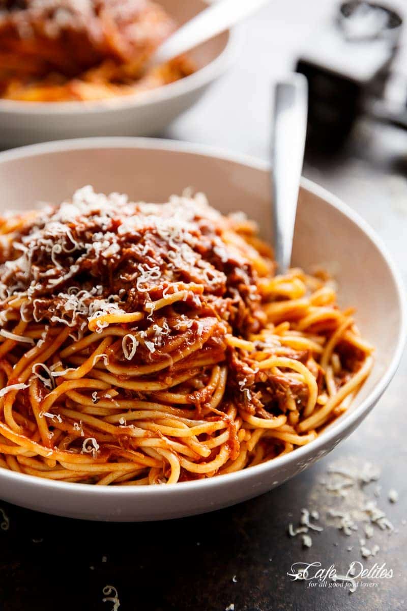 Slow Cooker Beef Ragu with spoon in a bowl