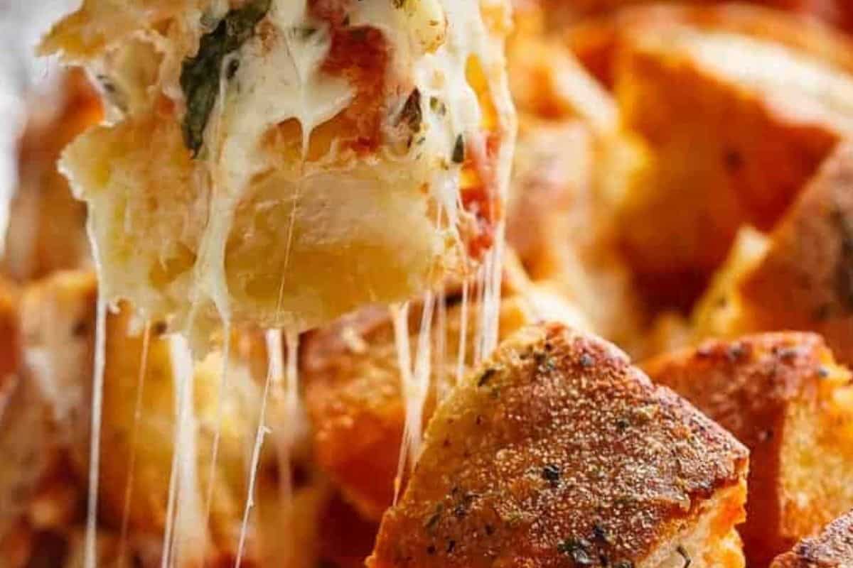 Uncover and bake about 10 minutes until the crust is crunchy and the cheese is fully melted.