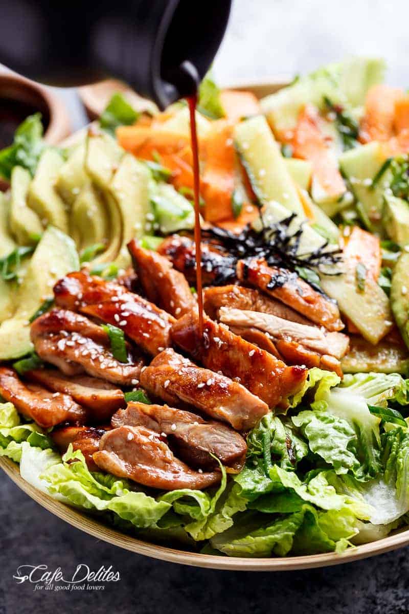 Dressing pouring on Teriyaki Glazed Chicken Salad