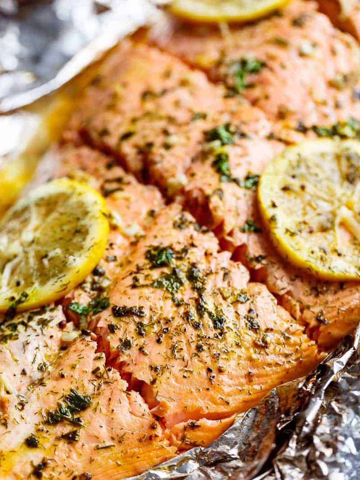 Zoom in image of Lemon Butter Garlic Salmon with lemon slices on a foil