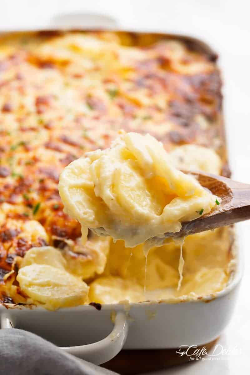 Garlic Parmesan Scalloped Potatoes layered in a creamy garlic sauce with parmesan and mozzarella