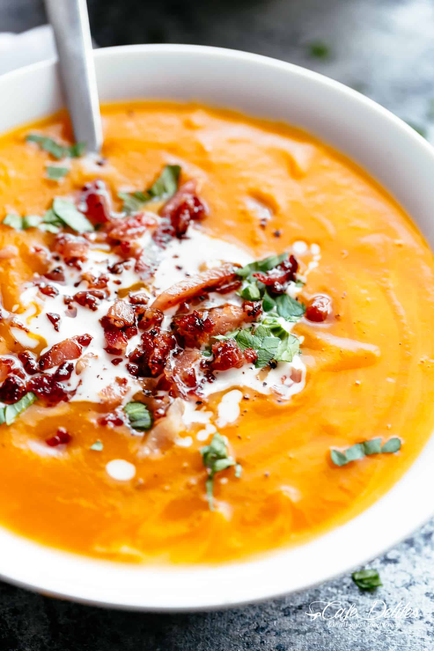Pumpkin Soup with spoon in a bowl