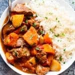 Slow Cooker Beef Stew with rice on a plate