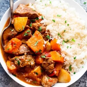 Slow Cooker Beef Stew with rice on a plate