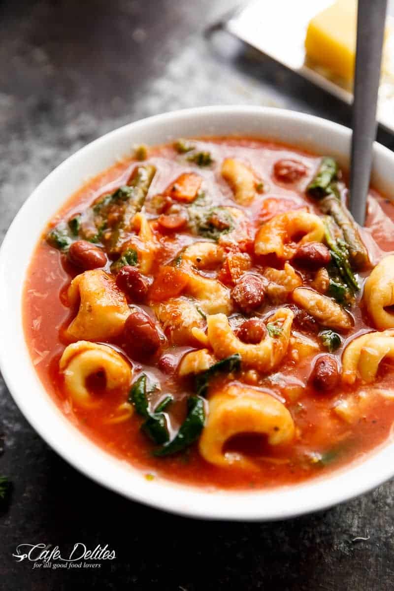 Top view image of Slow Cooker Tortellini Minestrone Soup in a bowl