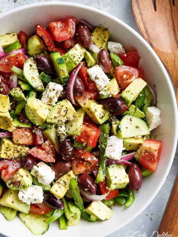 Yum Avocado Greek Salad with a Greek Salad Dressing in a bowl