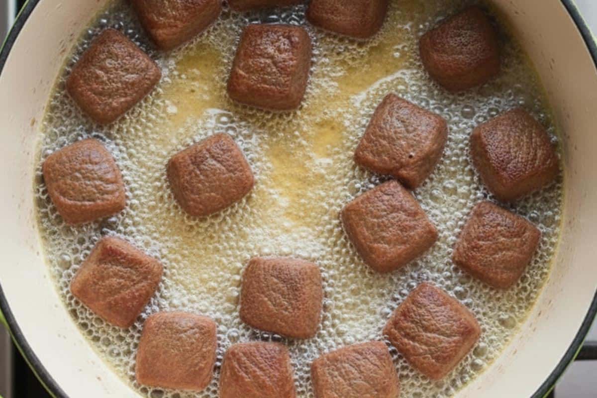 Seering the beef in an oven-safe pot.