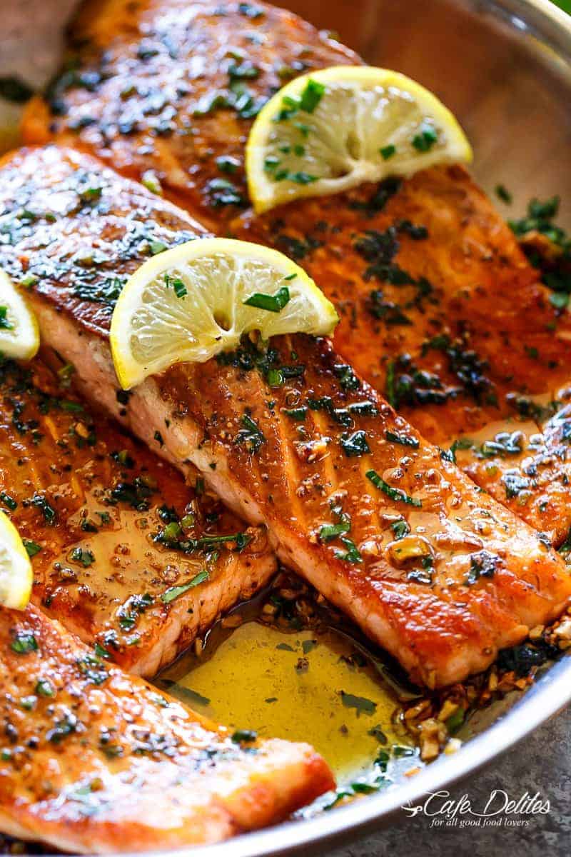 Pan Seared Salmon with Lemon Garlic Butter Sauce with lemon wedges