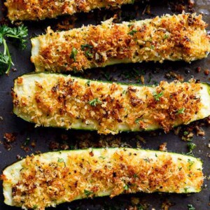 Parmesan Crusted Zucchini are easy to make and are one of THE best ways to enjoy zucchini! Crispy and crunchy, the perfect side dish OR snack! |