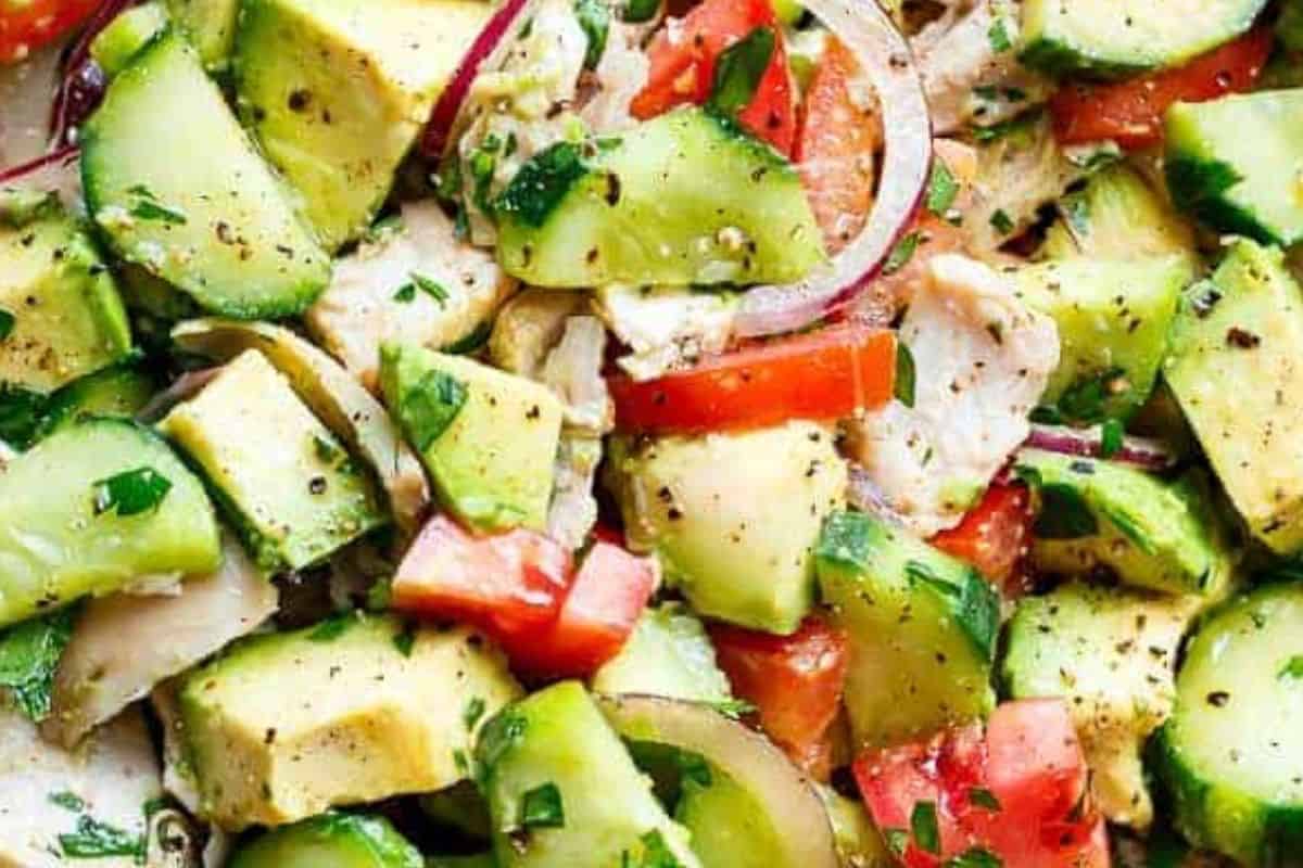 In a large salad bowl, mix together the shredded chicken, cucumbers, tomatoes, red onion, avocados, and chopped parsley