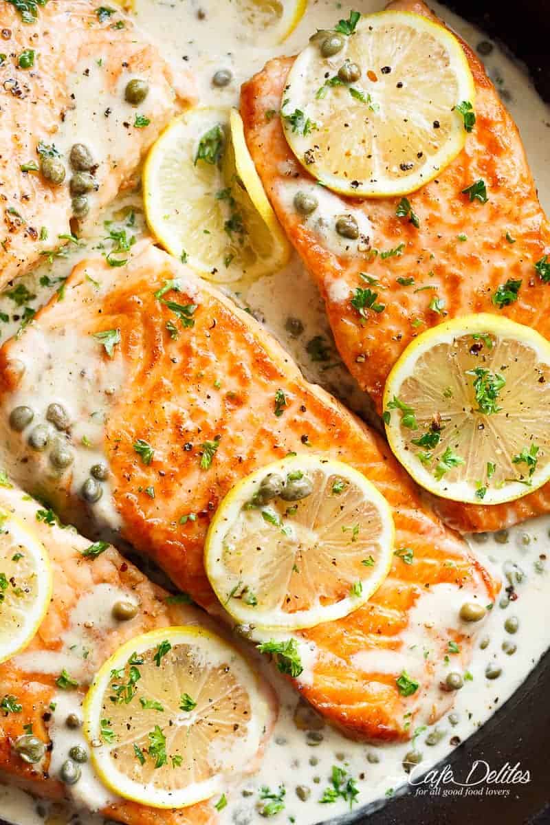 Creamy Lemon Garlic Salmon Piccata is a classy yet easy salmon recipe you\'ve been waiting for, with a delicious creamy lemon caper sauce!